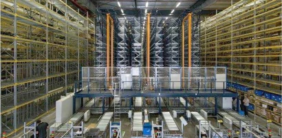 A large automated warehouse operated by Globus Worldwide Logistics, with tall shelves stacked on both sides, conveyor belts, machinery, and a few workers on the ground floor managing packages and inventory.