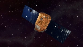 A Venus satellite with large blue solar panels and a central, rock-like body floats in outer space against a backdrop of distant stars.