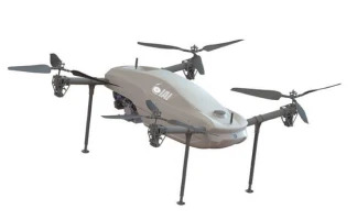 A gray, four-rotor drone with extended landing legs stands on a white background. The drone has an aerodynamic body and the logo “IAI” printed on its side.