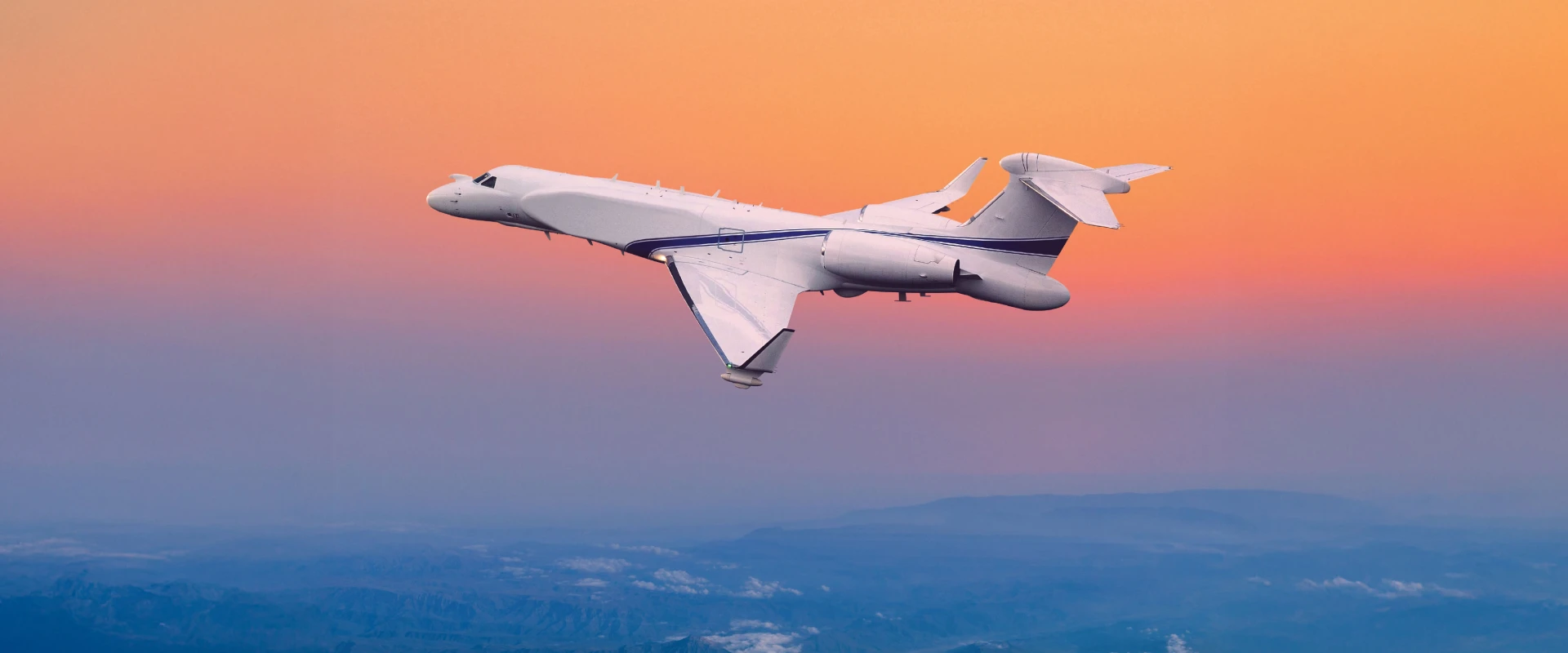 A white jet aircraft equipped with early warning radar soars above mountains at sunset, its distinctive tail fin silhouetted against an orange and purple sky.
