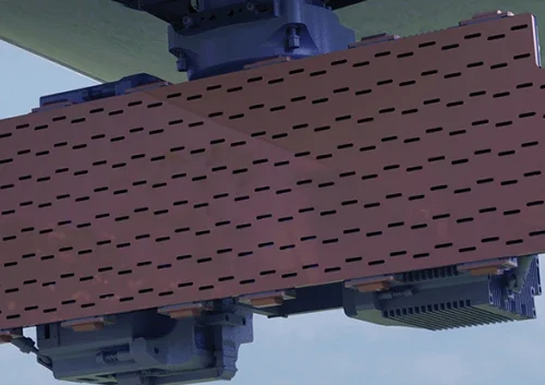Rectangular maritime surveillance radar array with a grid of small slotted openings mounted under the wing of an aircraft, set against a blue sky background.