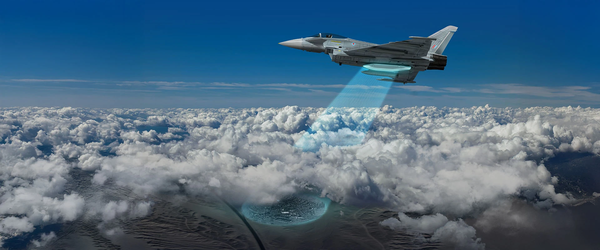 A fighter jet equipped with a radar pod system flies above the clouds, emitting a blue scanning beam downward that illuminates a circular area on the ground under a clear blue sky.
