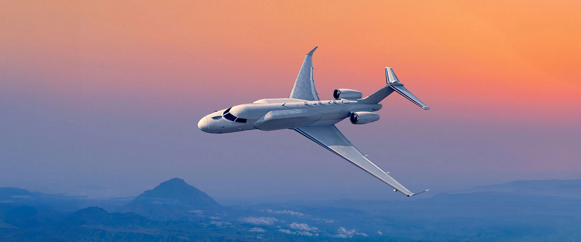 A sleek white private jet from in class systems flies in a clear sky at sunset, vibrant orange and purple hues in the background and distant mountains below.