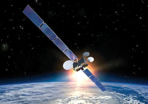 A satellite with large solar panels and MCS technology orbits above Earth, with a sunrise or sunset casting a glow against the star-filled space.
