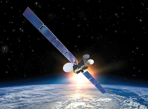 A satellite with large solar panels and MCS technology orbits above Earth, with a sunrise or sunset casting a glow against the star-filled space.