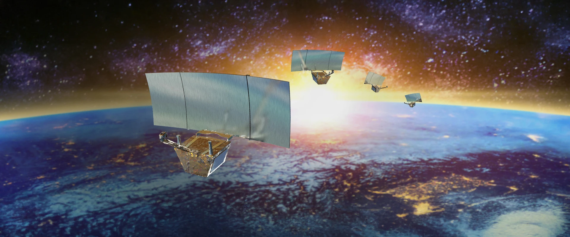 Four small satellites with reflective panels designed for SAR radar purposes orbit above Earth as the sun rises, with outer space and distant stars in the background.