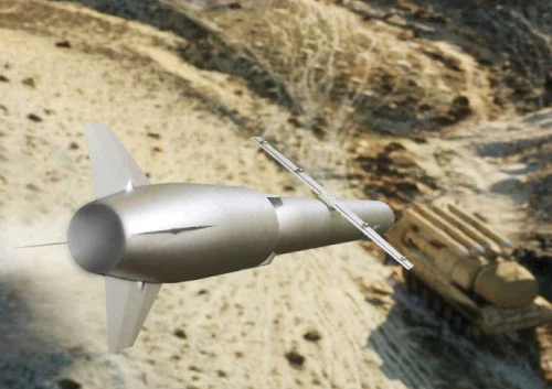 A surface cruise missile soars over sandy, rugged terrain, precisely targeting a camouflaged military vehicle or equipment hidden on the ground.