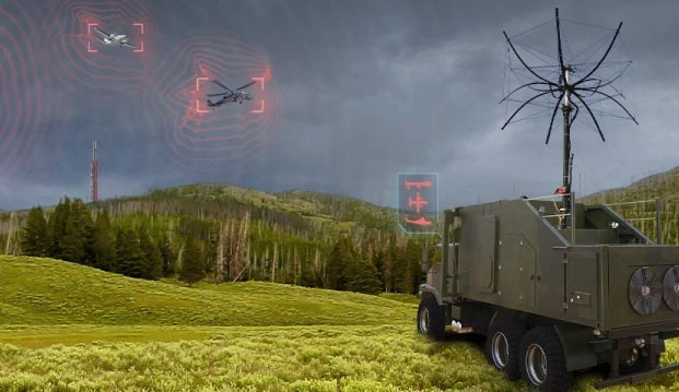 A military vehicle with an antenna, possibly equipped with IAI ELTA or PASP technology, is stationed in a grassy field, detecting two drones in the cloudy sky. Red digital overlays highlight the drones and signal activity near a forested area.