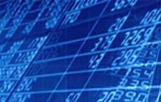 A blue-tinted digital screen displays rows of financial data and grids, suggesting trading or economic information, possibly related to IAI revenue or a recent IAI press release.