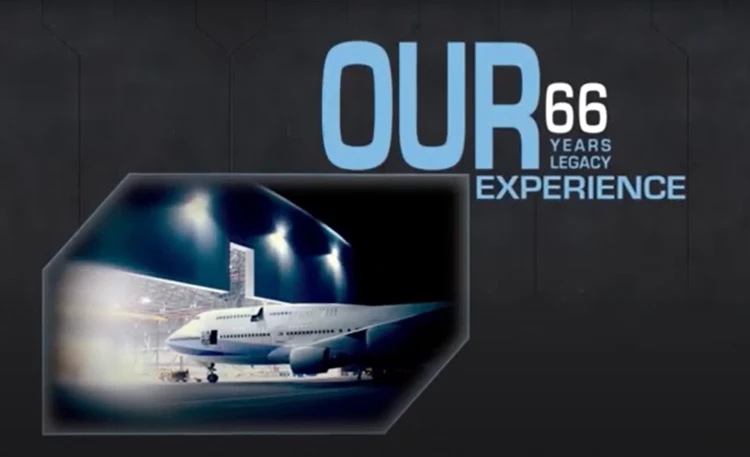A large IAI airplane is parked outside a hangar at night, illuminated by bright lights. The text beside it reads OUR 66 YEARS MRO LEGACY EXPERIENCE in bold blue and white letters on a dark background.