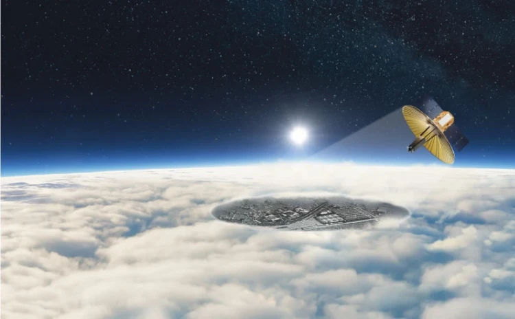 A satellite branded with IAI hovers above Earth’s atmosphere, shining a beam onto a circular city partly hidden under thick clouds, as the sun rises on the horizon and distant stars sparkle in space.