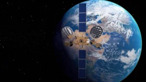 An IAI satellite with large solar panels orbits above Earth, the blue and white cloud-covered planet shining in the background against the blackness of space.