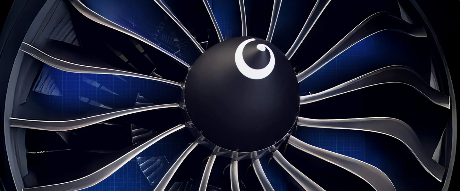 Close-up view of a jet engine fan with sleek, metallic blades arranged around a central hub, set against a blue background with faint technical details visible.